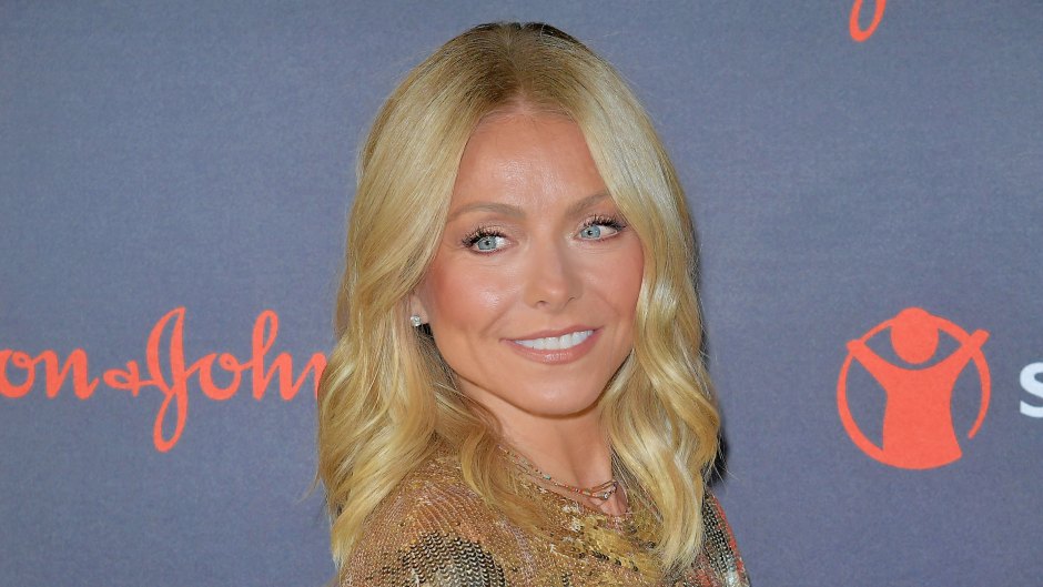 Kelly Ripa looks over her shoulder in a gold sequined dress
