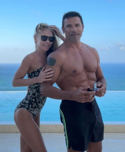 Kelly Ripa and Mark Consuelos wear swimsuits at pool