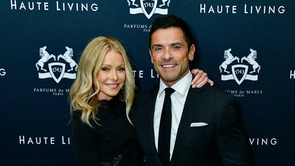 Kelly Ripa and Mark Consuelos embrace on the red carpet in black outfits