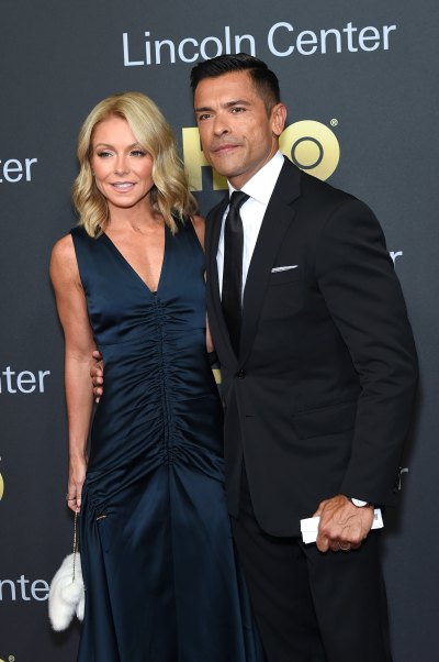 Kelly Ripa and Mark Consuelos stand side by side on red carpet