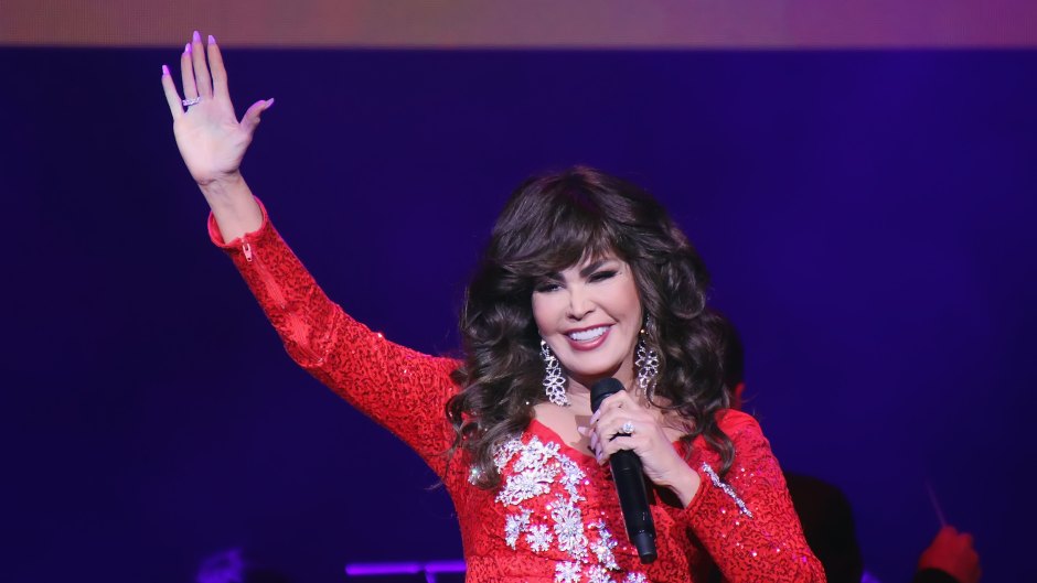 Marie Osmond waving to crowd on stage