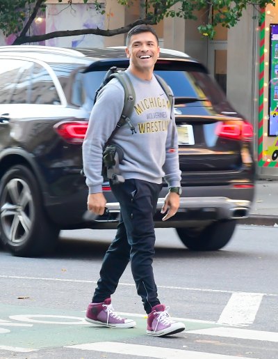 Mark Consuelos in a sweatshirt and jeans during stroll