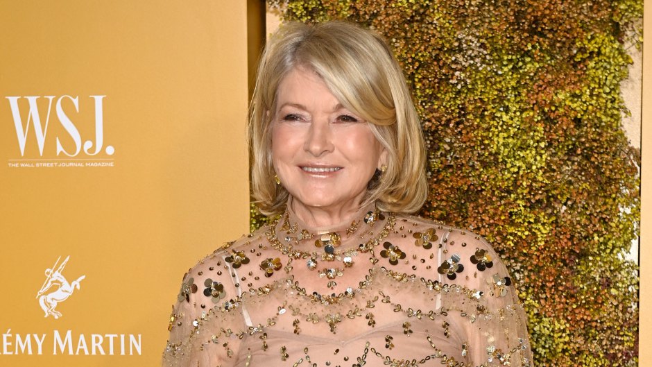 Martha Stewart in a gold blouse and tan pants