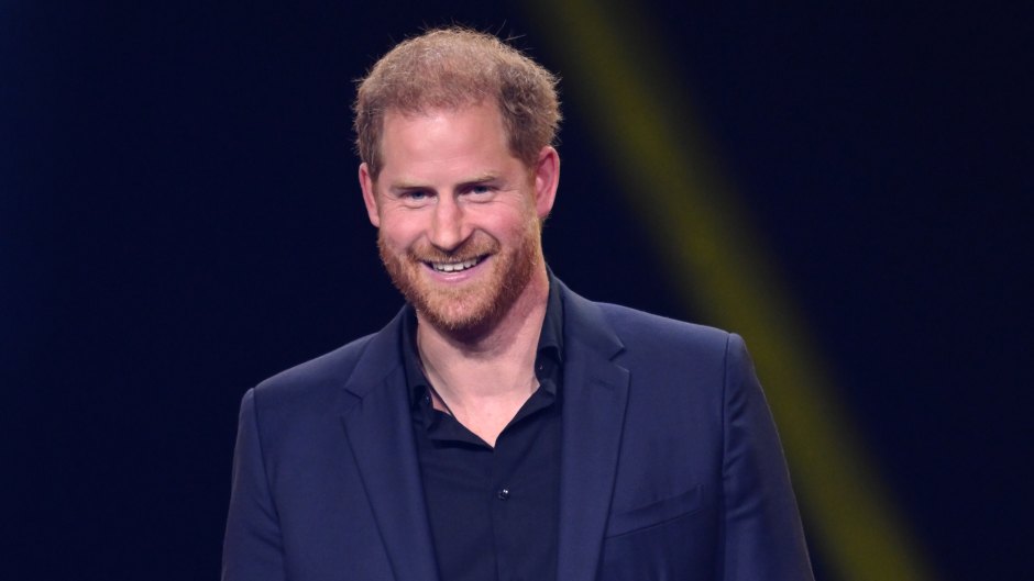 Prince Harry makes speech while wearing a black suit