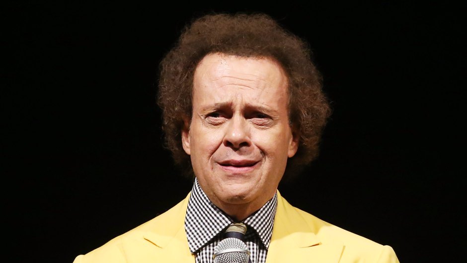 Richard Simmons in a yellow blazer holding a microphone