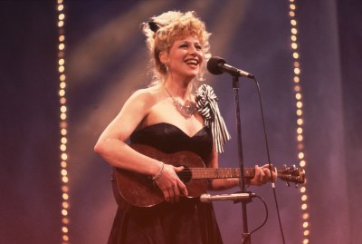 Victoria Jackson performing on stage with a ukelele