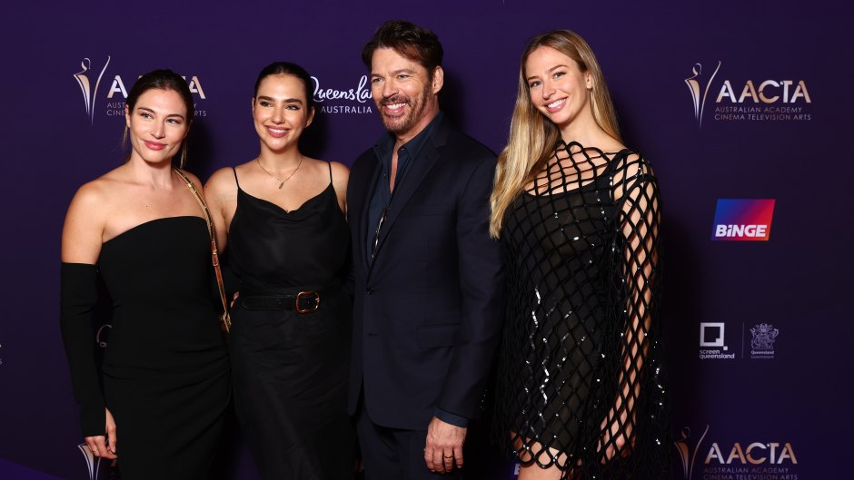Harry Connick Jr. poses with daughters on red carpet