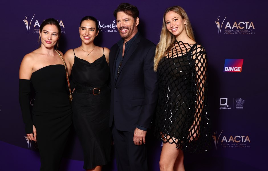 Harry Connick Jr. poses with daughters on red carpet
