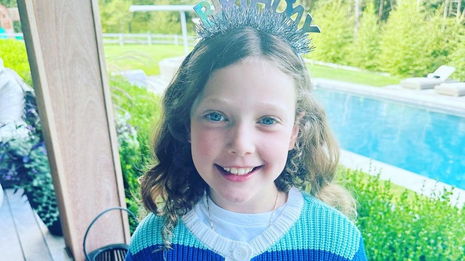 Savannah Guthrie's daughter Vale Feldman wearing a tiara with a blue striped sweater on her 9th birthday