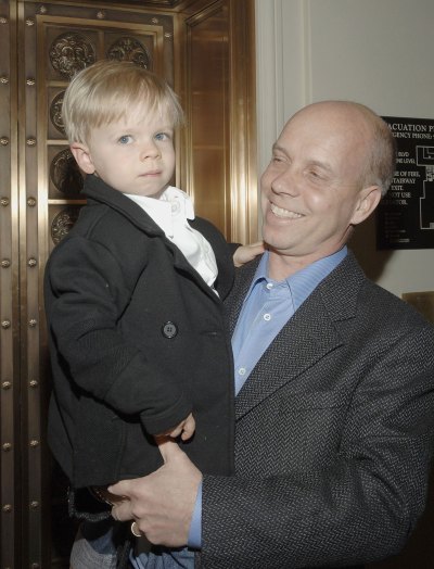 Scott Hamilton holds his son