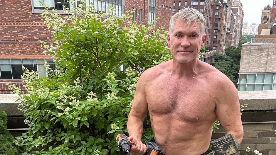 Sam Champion shirtless in his garden