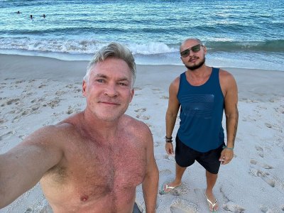 Sam Champion shirtless on the beach