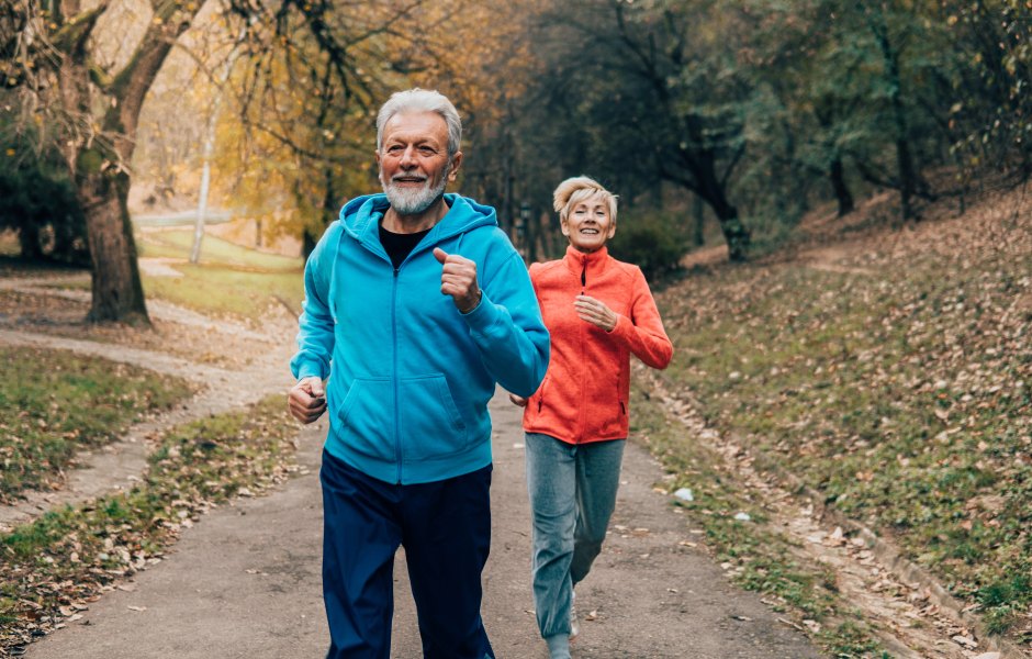 Senior couple jogging outdoors